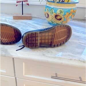 Dr. Martens black shoes. Never worn.  Size 8 ladies, size 7 men's.